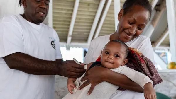 A health worker uses a MUAC tape to assess the nutritional status of a 5-month-old baby on Pele Island, Efate, SHEFA, Vanuatu on Oct. 9, 2025.