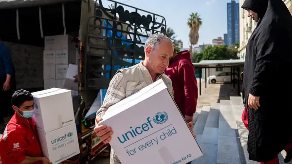 On March 3, 2026, a UNICEF team unloads a truck full of emergency supplies at a shelter in Mount Lebanon for families displaced by escalating conflict.