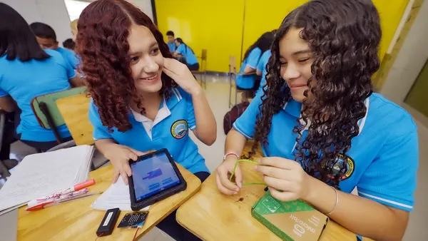 Two students in a classroom in Honduras take part in a tech lesson as part of a UNICEF-supported pilot program.