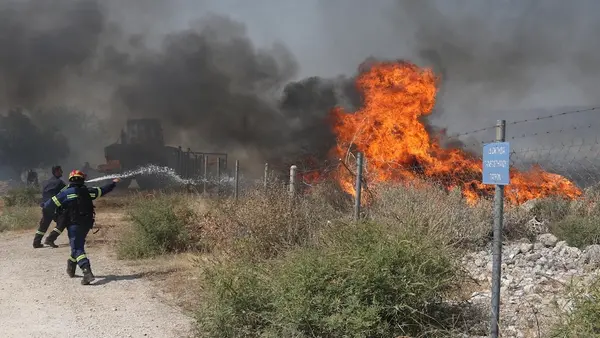 Firefighters fight a wildfire near Patras, Greece.