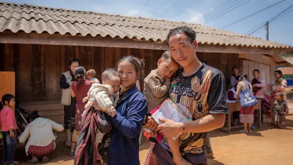 TOP PHOTO: LiXong and her husband bring their children to receive polio vaccinations at an outreach point in Song Nuea Village, Lao People’s Democratic Republic. 
