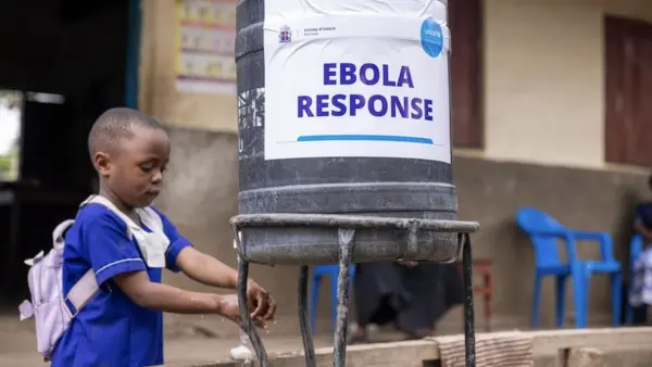A young girl uses a handwashing station provided by UNICEF in Uganda. 