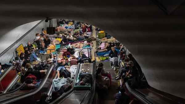 Families shelter from overnight attacks inside a Kyiv metro station on July 30, 2026.