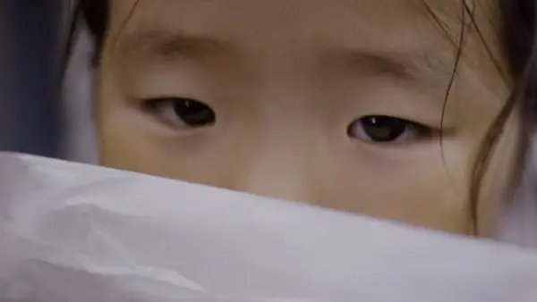 Young Girl in a Mask