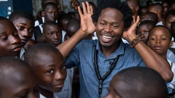 Former child soldier, and author Ishmael Beah visiting the school he studied in as a child July 1, 2016 in Freetown, Sierra Leone.