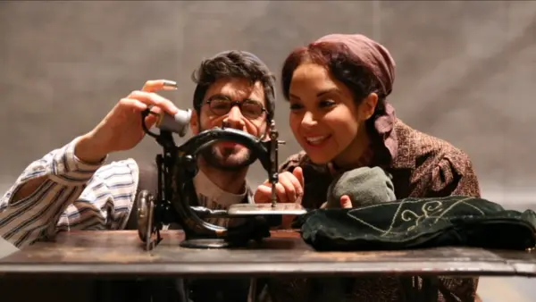 Two People Using Vintage Machine