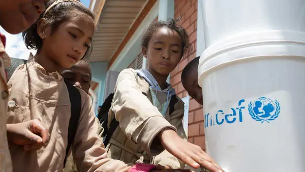 Children Get Water from UNICEF Jug