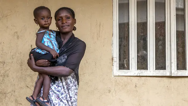 Woman Holding Child