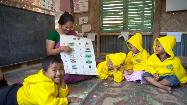 Woman Teaching Children