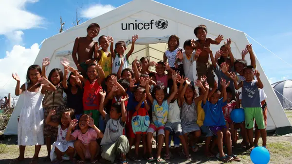 Children Gather in Front of UNICEF Tent