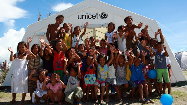 Children Gather in Front of UNICEF Tent