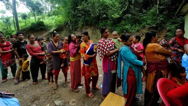 Women and Children Waiting in Line
