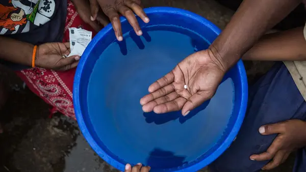 Verenaisi Lakosi from Lawaki village in Tailevu Province, holds a water purification tablet that she uses to make tap water safe and sanitary to drink.