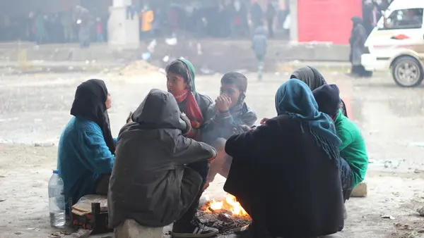 People Huddled Around Fire