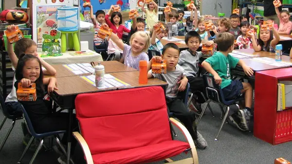 1st Graders at Bell School show off their Trick-or-Treat for UNICEF boxes