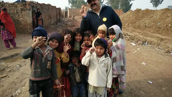 AG Nosherwan Khan with children in rural Pakistan, 2017.