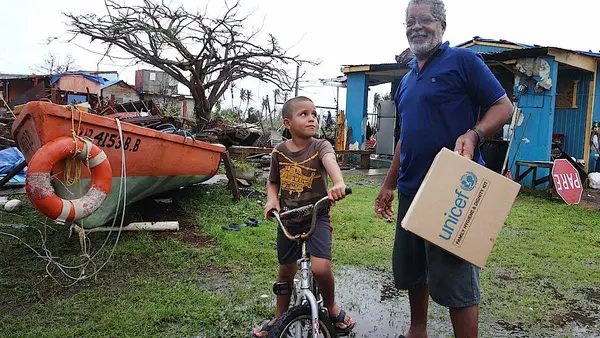 After Hurricane Maria hit Puerto Rico, a father and son received a Family Dignity and Hygiene Kit from UNICEF USA