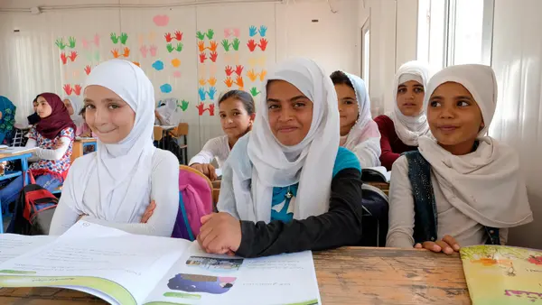 On 11 September 2017, Syrian refugee students in the fourth grade smile during a visit by UNICEF Goodwill Ambassador Priyanka Chopra to their school in Za’atari refugee camp, Mafraq Governorate, Jordan.