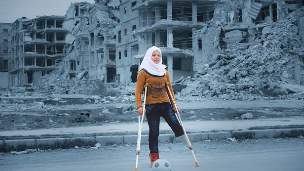 Injured during a bomb attack in Syria's civil war, Saja dreams of one day taking part in the Special Olympics. She practices doing aerial flips every day in her tiny apartment. “I love playing football. When I play football, I don’t feel like I’ve lost an