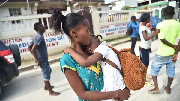 Woman Holding Child