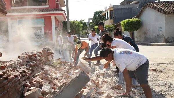 On 9 September 2017 in Oaxaca, Mexico, adolescent volunteers from San Blas Atempa help to remove debris and clear the streets of San Mateo del Mar affected by the earthquake.