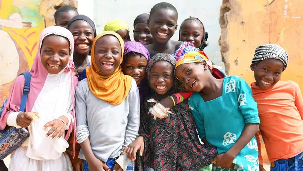 Friends smile in Korohogo, in southwest Côte d’Ivoire.