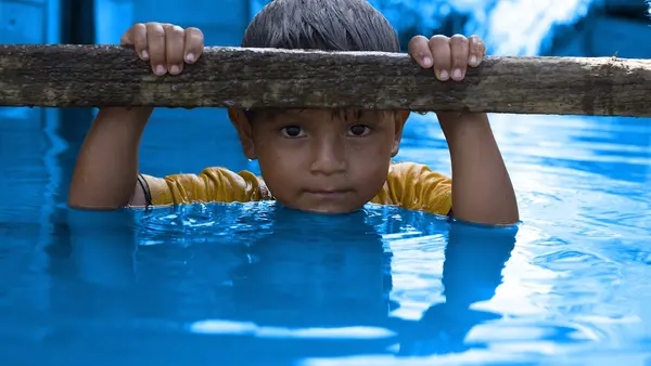 Boy in Floodwaters