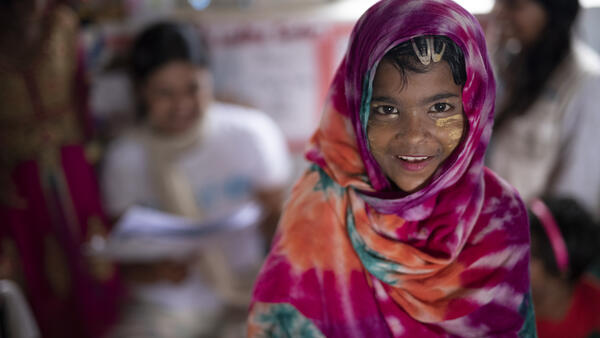 Girl in Pink Scarf Smiling
