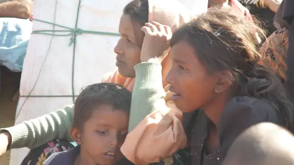 Umme, a 12-year-old Rohingya refugee, far right, fled Myanmar with her family. Now they are living in Cox's Bazar, Bangladesh.