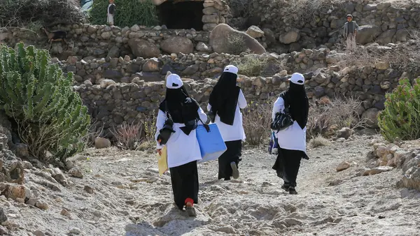 Health workers in Yemen climb mountains to vaccinate children in remote villages. 