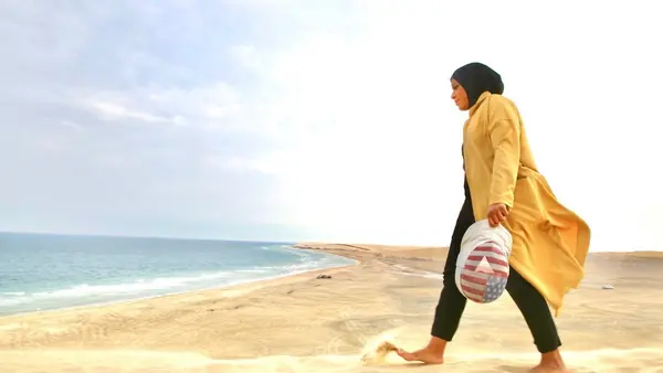 Ibtihaj Muhammad on the beach in Sealine, Qatar. 