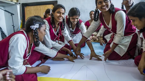 Adolescent girls in Jharkhand, India, participate in a body-mapping activity, part of a UNICEF-supported program to improve menstrual health and hygiene and help girls stay in school.