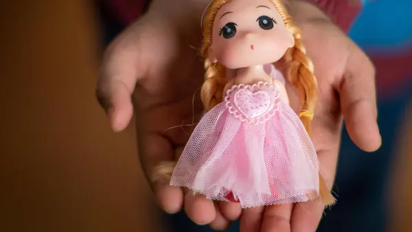 Yara, 10, still has her little doll from Syria in Za'atari Refugee Camp. 