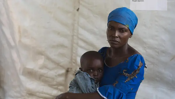 Zuliya Nboyo brings her son, Kayoka, 2. to a community health worker at an Internally Displaced Persons camp in Kalemi, Tanganyika province, Democratic Republic of Congo in November 2018. 