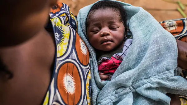 Mujinga, 30, holds her 2-week-old daughter, Francine, in Kananga, Kasai-Occidental Province, Democratic Republic of Congo in March 2019. 