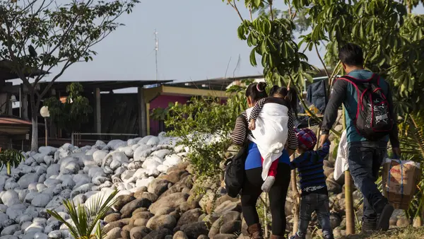 A family crosses the Suchiate River at the Mexico-Guatemala border in Ciudad Hidalgo, Mexico on January 31, 2019.