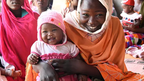 Mothers and babies wait to be vaccinated at the UNICEF-supported health center in Ambatta, a suburb of Ndjamena, the capital of Chad, in 2019. 
