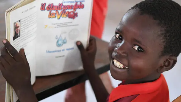 This boy is reading a book in the library of a cultural center in Mongo, Chad. 