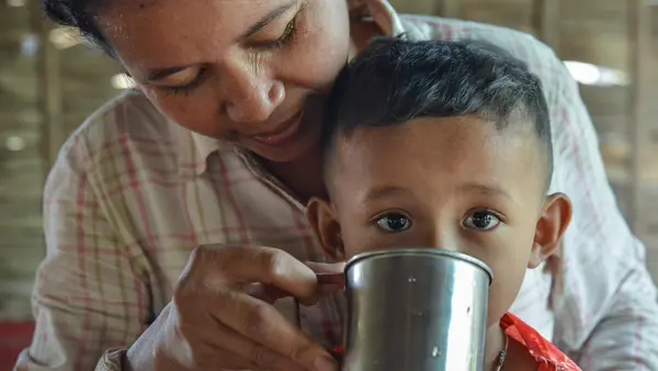 In Cambodia's Kompong Cham province, Ven Thuy, 38, and her child have safe, clean water to drink, thanks to the Kampong Chamlong Water Supply utility's partnership with UNICEF. 