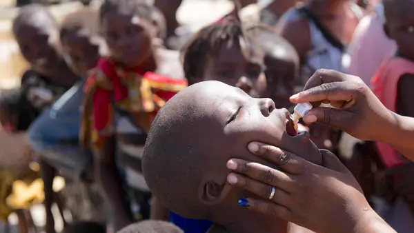 On April 3 in Beira, Mozambique, a child receives the vaccine for cholera as part of a UNICEF-supported immunization campaign in the wake of Cyclone Idai. 