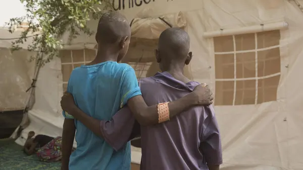 Two injured children outside a UNICEF tent at the regional hospital in Mopti, Mali, April 2019.