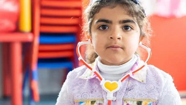 Haneen, 5, in her new kindergarten classroom, built and equipped by UNICEF, in Za'atari Refugee Camp in Jordan.