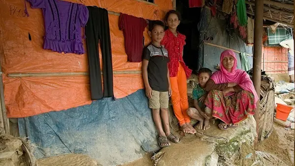 On 11 July 2019 in Bangladesh, (left-right) Mohammad Jonayed, Jannatul Noor, Mohammad Shoyef and Ramjana Begum outside their shelter in Jamtoli camp in Cox's Bazar. 