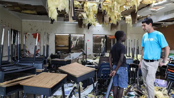 On 7 September 2019, in Marsh Harbour, Abaco Island, Bahamas. In the aftermath of Hurricane Dorian, Torres, 10, talks to UNICEF’s Regional Emergency Specialist Hanoch Barlevi in his totally destroyed classroom in Central Abaco public school. 