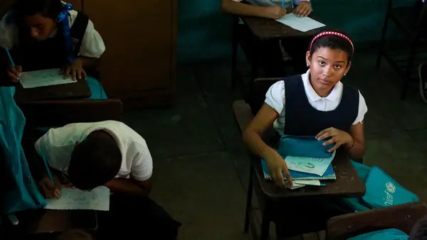 Valeria, 10, goes to a UNICEF-supported school in Maracaibo, Venezuela, where power shortages have forced teachers to shorten the school day.