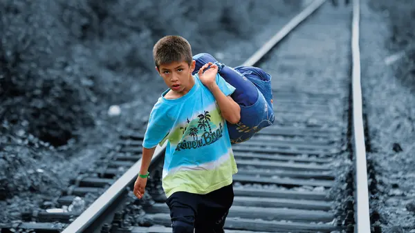 A Syrian refugee crossing into Serbia.