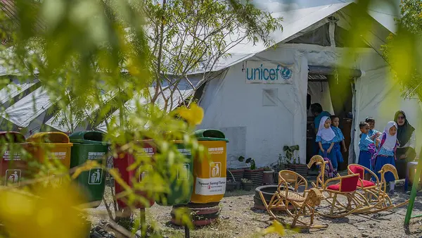 Students leave the UNICEF tent after class finishes in Marawola subdistrict, Central Sulawesi, Indonesia on September 11, 2019.