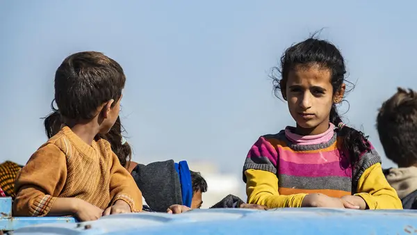 In October 2019, families fleeing escalating violence in northeast Syria continue to arrive in Tal Tamer, carrying only the bare essentials. 