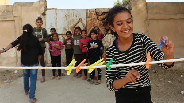 On October 28, 2019 at a shelter in Hasakeh City, Syria, Amani, 12, takes part in game organized by UNICEF staff to help displaced children heal from trauma. 