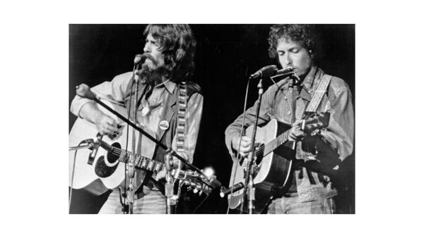 Two People Playing Guitar and singing
